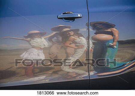 Reflection of pregnant woman and family on sunny car door View Large Photo Image Stock Photograph - Reflection of pregnant woman and family on sunny car door. Fotosearch