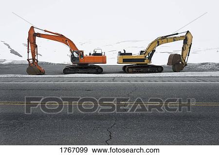 Road clearing excavators parked at roadside along Colony Glacier, Knik Valley, Anchorage, Alaska View Large Photo Image Stock Photo - Road clearing excavators parked at roadside along Colony Glacier, Knik Valley, Anchorage, Alaska. Fotosearch