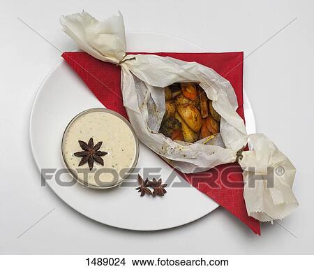 Roasted potatoes and root vegetables by sauce in plate View Large Photo Image Picture - Roasted potatoes and root vegetables by sauce in plate. Fotosearch