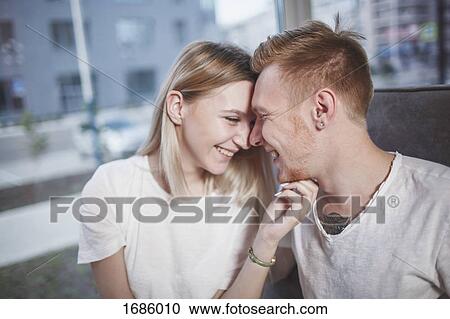 Romantic young couple at restaurant View Large Photo Image Stock Image - Romantic young couple at restaurant. Fotosearch