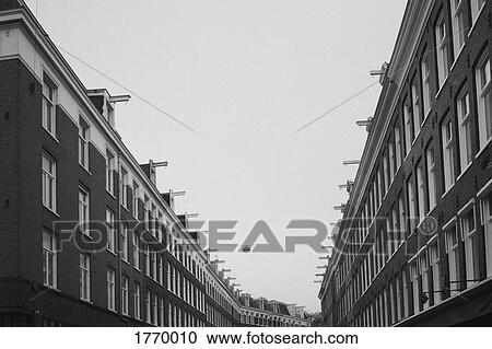 Row houses under overcast sky, Amsterdam, Netherlands, Holland View Large Photo Image Stock Image - Row houses under overcast sky, Amsterdam, Netherlands, Holland. Fotosearch