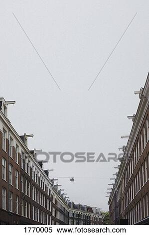 Row houses under overcast sky, Amsterdam, Netherlands, Holland View Large Photo Image Stock Photography - Row houses under overcast sky, Amsterdam, Netherlands, Holland. Fotosearch