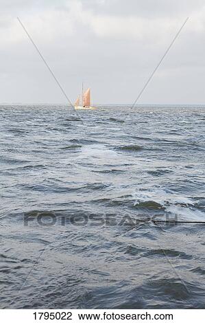 Sailboat on choppy ocean View Large Photo Image Stock Image - Sailboat on choppy ocean. Fotosearch