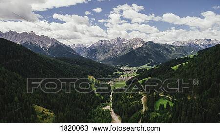 Scenic view majestic mountains and lush green valley, Drei Zinnen Nature Park, South Tyrol, Italy View Large Photo Image Stock Image - Scenic view majestic mountains and lush green valley, Drei Zinnen Nature Park, South Tyrol, Italy. Fotosearch