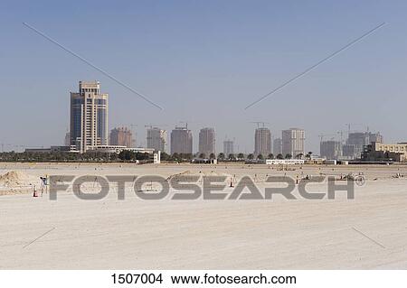 Scenic view of field and cityscape against sky View Large Photo Image Picture - Scenic view of field and cityscape against sky. Fotosearch