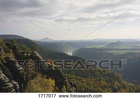 Scenic view of landscape against sky, Elbe Sandstone Mountains, Germany View Large Photo Image Stock Photo - Scenic view of landscape against sky, Elbe Sandstone Mountains, Germany. Fotosearch