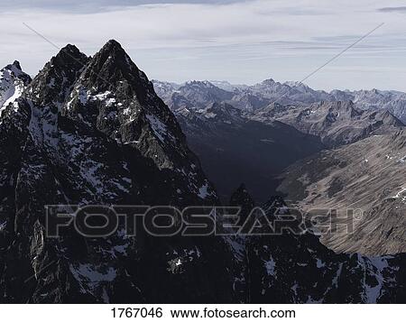 Scenic view of rugged mountain range, Ischgl, Tyrol, Austria View Large Photo Image Stock Photograph - Scenic view of rugged mountain range, Ischgl, Tyrol, Austria. Fotosearch