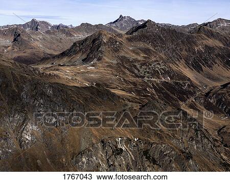 Stock Image - Scenic view rugged brown mountain range, Ischgl, Tyrol, Austria. Fotosearch