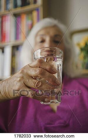 Senior woman drinking water View Large Photo Image Stock Image - Senior woman drinking water. Fotosearch