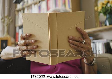Senior woman reading book View Large Photo Image Stock Image - Senior woman reading book. Fotosearch