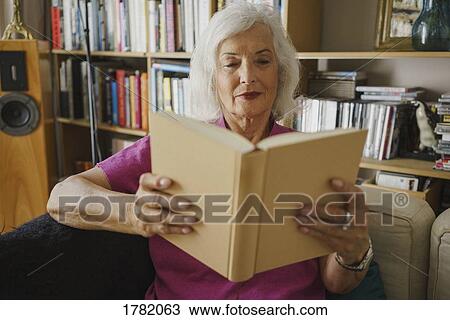 Senior woman reading book View Large Photo Image Stock Image - Senior woman reading book. Fotosearch