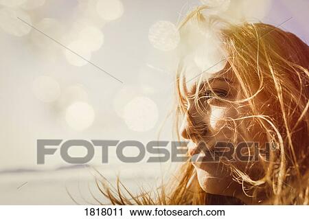 Serene woman enjoying sunshine View Large Photo Image Stock Image - Serene woman enjoying sunshine. Fotosearch