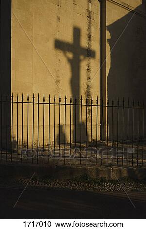Shadow of crucifix on wall View Large Photo Image Stock Image - Shadow of crucifix on wall. Fotosearch