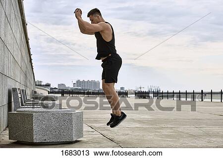 Side view of young male athlete jumping on footpath against sky, Blagoveshchensk, Amur, Russia View Large Photo Image Stock Image - Side view of young male athlete jumping on footpath against sky, Blagoveshchensk, Amur, Russia. Fotosearch