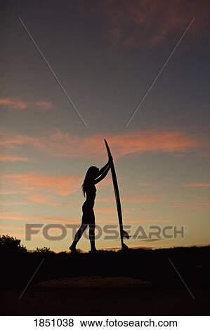 Silhouette female surfer with surfboard on beach at dusk View Large Photo Image Stock Photo - Silhouette female surfer with surfboard on beach at dusk. Fotosearch