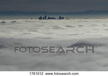 Silhouetted skyscraper buildings above clouds, Vancouver, British Columbia View Large Photo Image Stock Image - Silhouetted skyscraper buildings above clouds, Vancouver, British Columbia. Fotosearch