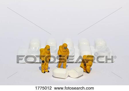 Small scientists in clean suits examining white tablet from blister pack View Large Photo Image Stock Image - Small scientists in clean suits examining white tablet from blister pack. Fotosearch