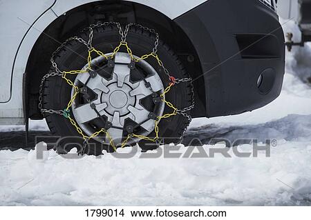 Snow chains on parked car View Large Photo Image Picture - Snow chains on parked car. Fotosearch