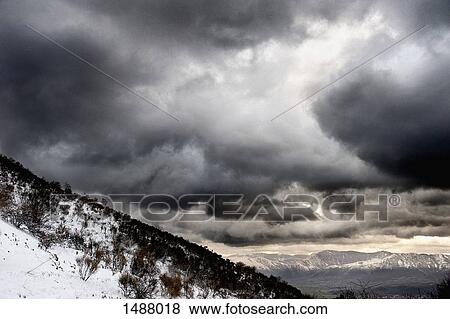 Snow covered mountains against dramatic sky, Polla, Campania, Italy View Large Photo Image Stock Photo - Snow covered mountains against dramatic sky, Polla, Campania, Italy. Fotosearch