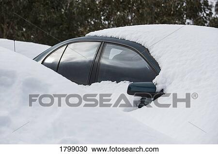 Snow covering parked car View Large Photo Image Stock Image - Snow covering parked car. Fotosearch