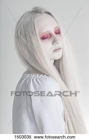 Spooky woman with closed red eyes and long hair against white background View Large Photo Image Stock Photography - Spooky woman with closed red eyes and long hair against white background. Fotosearch