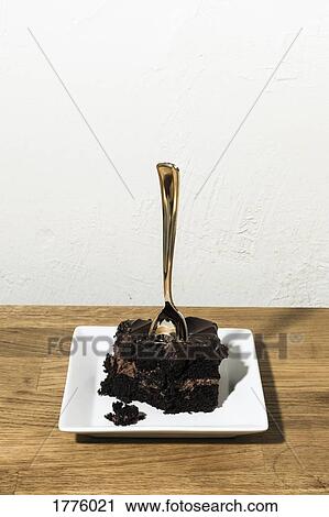 Spoon in piece of chocolate cake View Large Photo Image Stock Image - Spoon in piece of chocolate cake. Fotosearch