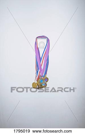 Sports medals hanging on wall thermostat View Large Photo Image Stock Photo - Sports medals hanging on wall thermostat. Fotosearch
