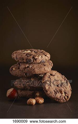 Stack of cookies with nuts on table View Large Photo Image Stock Photo - Stack of cookies with nuts on table. Fotosearch