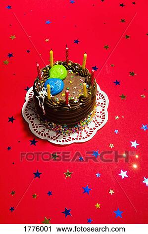 Still life chocolate birthday cake and star confetti View Large Photo Image Stock Image - Still life chocolate birthday cake and star confetti. Fotosearch