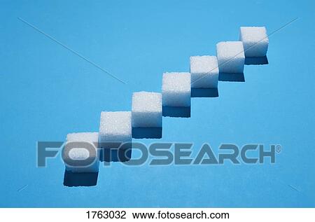 Sugar cubes forming pattern on blue background View Large Photo Image Stock Image - Sugar cubes forming pattern on blue background. Fotosearch