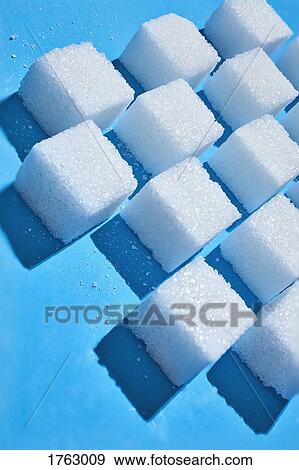 Sugar cubes forming pattern on blue background View Large Photo Image Stock Photo - Sugar cubes forming pattern on blue background. Fotosearch