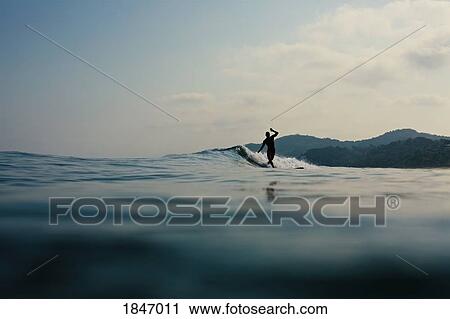 Surfer riding ocean wave, Sayulita, Nayarit, Mexico View Large Photo Image Stock Image - Surfer riding ocean wave, Sayulita, Nayarit, Mexico. Fotosearch