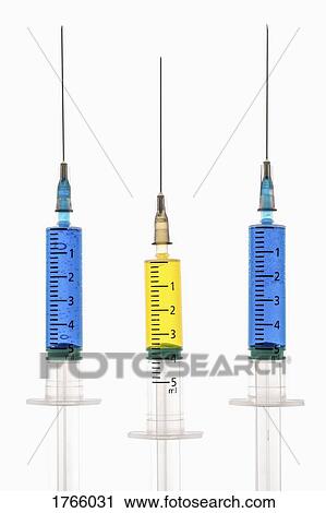 Syringes with blue and yellow liquid View Large Photo Image Stock Image - Syringes with blue and yellow liquid. Fotosearch