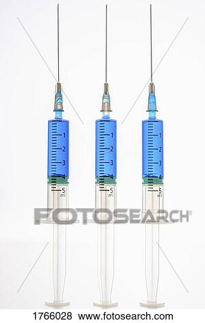Syringes with blue liquid View Large Photo Image Stock Photo - Syringes with blue liquid. Fotosearch