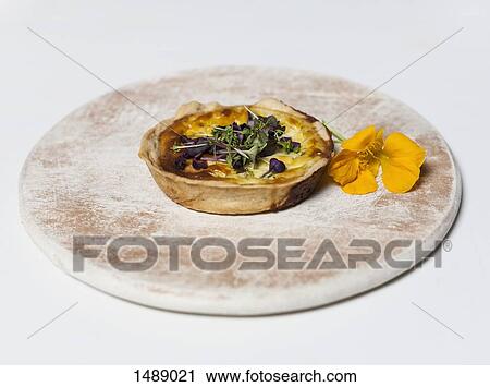 Stock Image - Tart on wood over white background. Fotosearch