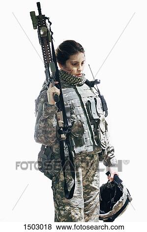 Stock Photo - Thoughtful army soldier with rifle and helmet standing against white background. Fotosearch