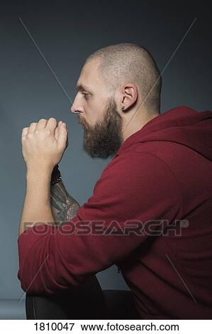 Thoughtful man with beard View Large Photo Image Stock Photo - Thoughtful man with beard. Fotosearch
