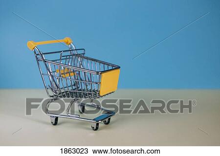 Tiny toy shopping cart View Large Photo Image Stock Image - Tiny toy shopping cart. Fotosearch