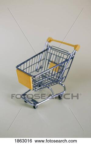 Tiny toy shopping cart View Large Photo Image Stock Photograph - Tiny toy shopping cart. Fotosearch