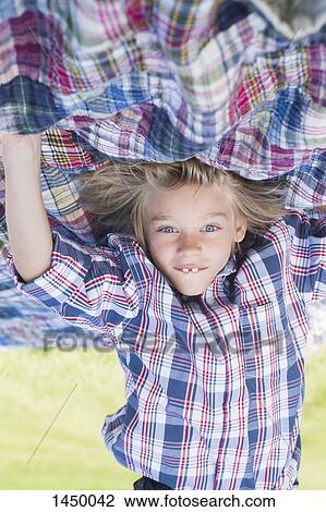 Upside down image of boy practicing headstand at backyard View Large Photo Image Stock Image - Upside down image of boy practicing headstand at backyard. Fotosearch