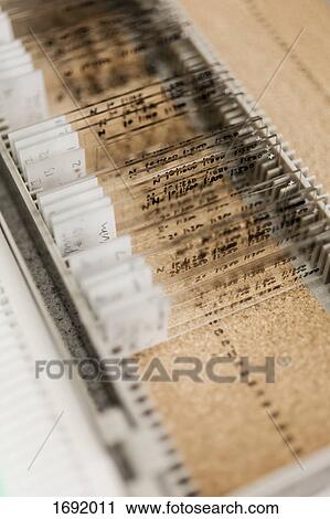 Stock Image - Various medical samples on microscope slides in box at laboratory. Fotosearch
