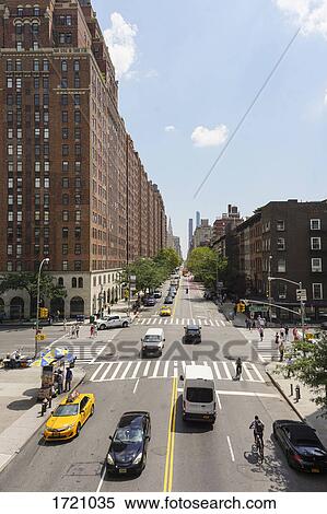 Vehicles moving on street by buildings in city, New York City, New York, USA View Large Photo Image Stock Photography - Vehicles moving on street by buildings in city, New York City, New York, USA. Fotosearch