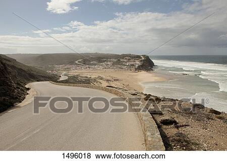 View from a road of a beach and cliffs, Monte Clerigo, Portugal View Large Photo Image Stock Photo - View from a road of a beach and cliffs, Monte Clerigo, Portugal. Fotosearch