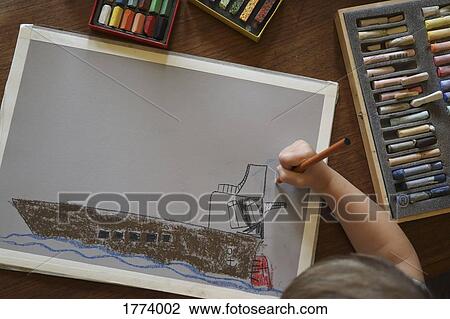 View from above boy drawing boat View Large Photo Image Stock Image - View from above boy drawing boat. Fotosearch