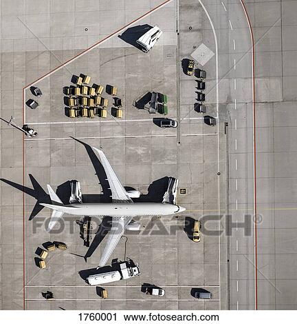 View from above commercial airplane being serviced, prepared on tarmac at airport View Large Photo Image Stock Image - View from above commercial airplane being serviced, prepared on tarmac at airport. Fotosearch