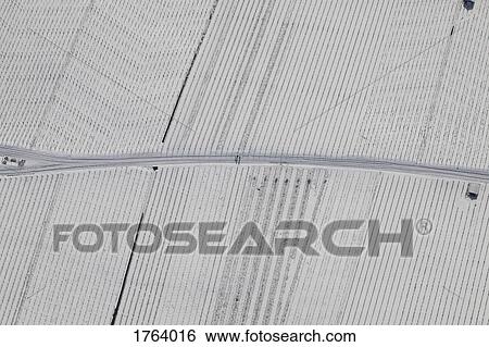 View from above snow covered farmland View Large Photo Image Stock Photograph - View from above snow covered farmland. Fotosearch