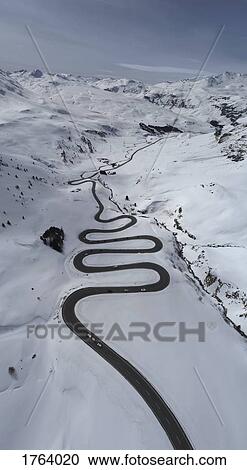 View from above winding road through snow covered mountain, St. Moritz, Switzerland View Large Photo Image Stock Image - View from above winding road through snow covered mountain, St. Moritz, Switzerland. Fotosearch