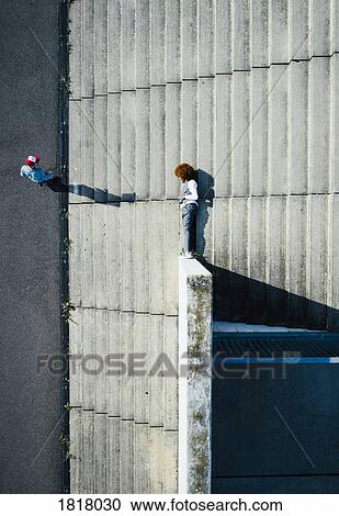 View from above young man laying on urban steps View Large Photo Image Stock Image - View from above young man laying on urban steps. Fotosearch