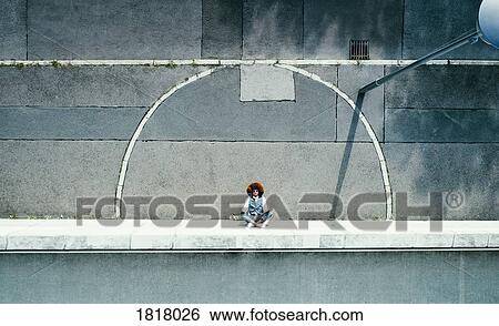 View from above young man meditating on urban sidewalk View Large Photo Image Stock Photograph - View from above young man meditating on urban sidewalk. Fotosearch