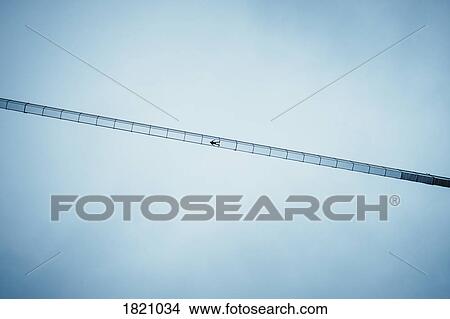 View from below boy laying on suspension bridge below blue sky, Tyrol, Austria View Large Photo Image Picture - View from below boy laying on suspension bridge below blue sky, Tyrol, Austria. Fotosearch